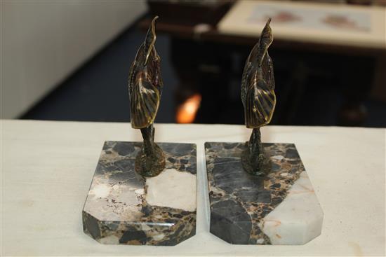 A pair of French Art Deco painted bronze bookends, modelled as fish amongst reeds, 5.5in.